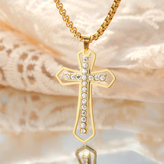 Beautiful key ring, necklace and earrings with a crucifix pendant made of zircon stones